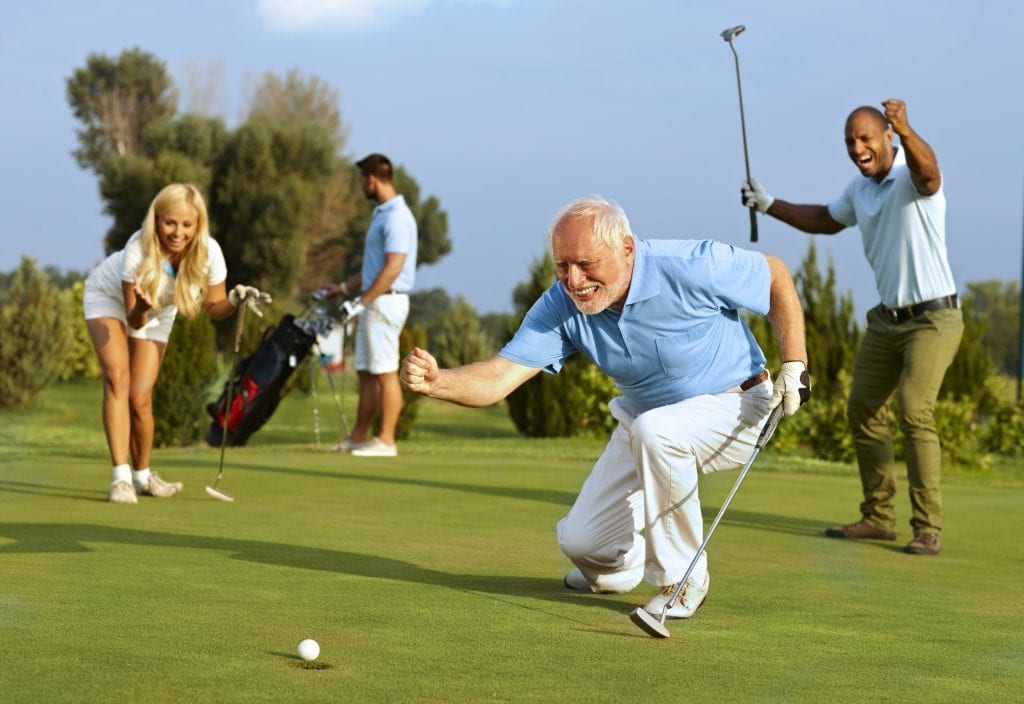 An old man is playing golf.