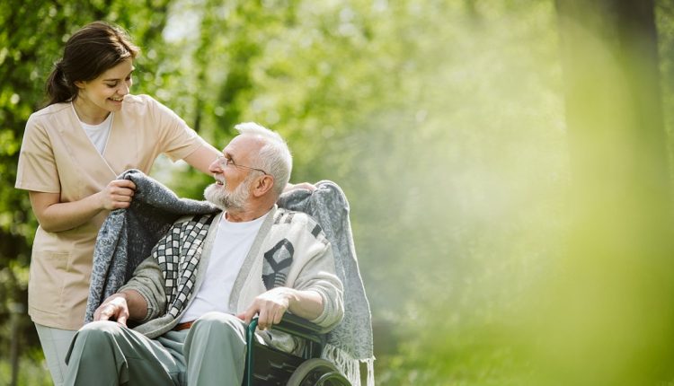 Careful caregiver taking care of Senior man