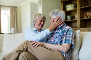 Senior couple sitting together on sofa at home. they have good relationship.