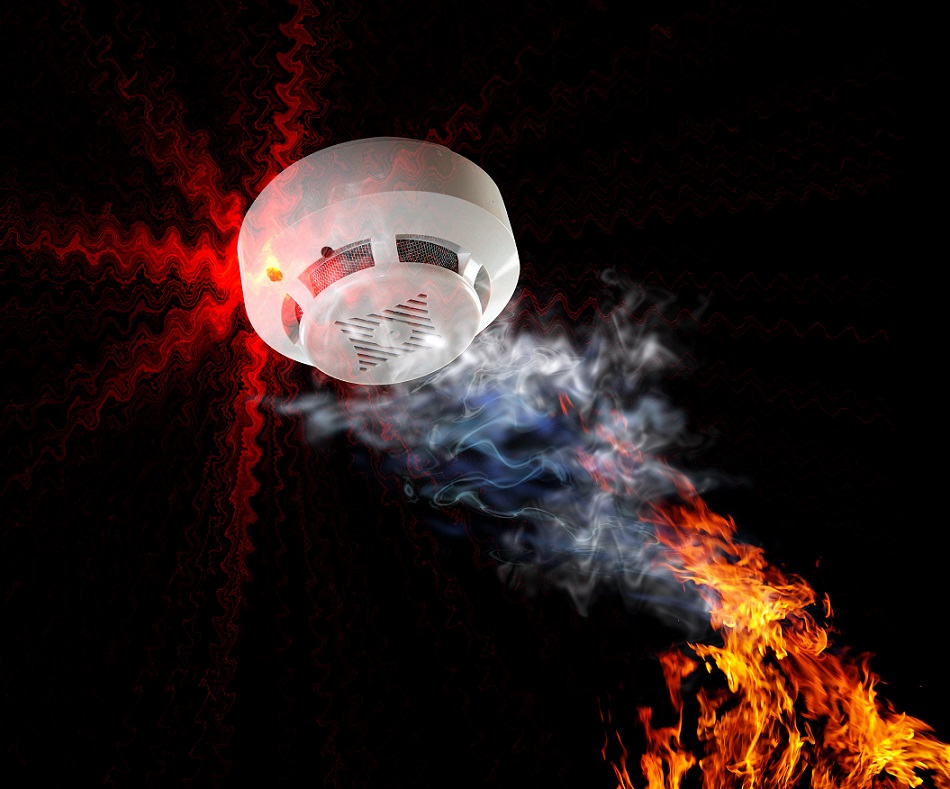 Photo of a smoke detector in a smart home  .Fire alarm will be triggered.
