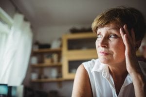 an elderly woman is worried and stressed