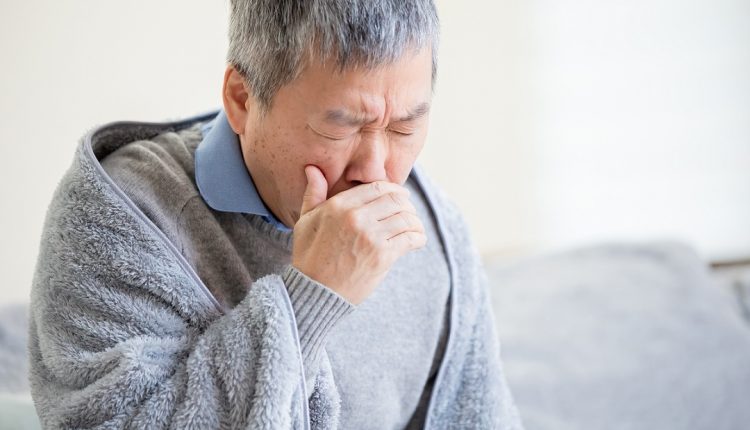 Senior Asian man couching