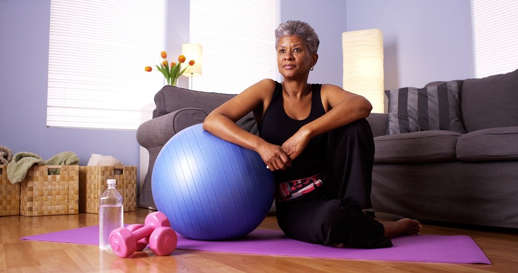 senior woman working with a medicne ball