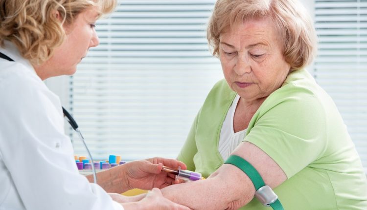 A senior woman having her blood tested