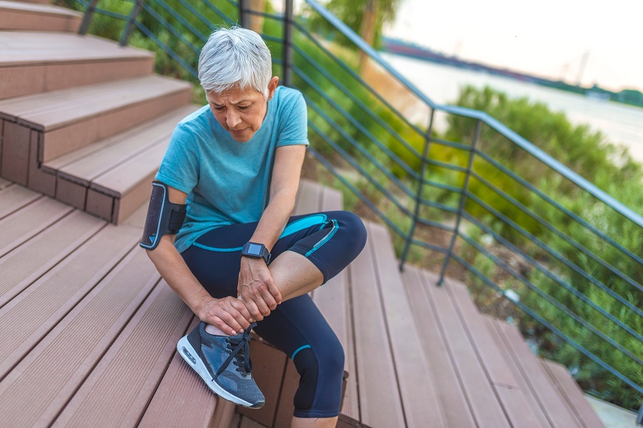 a senior woman with stretched muscle pain