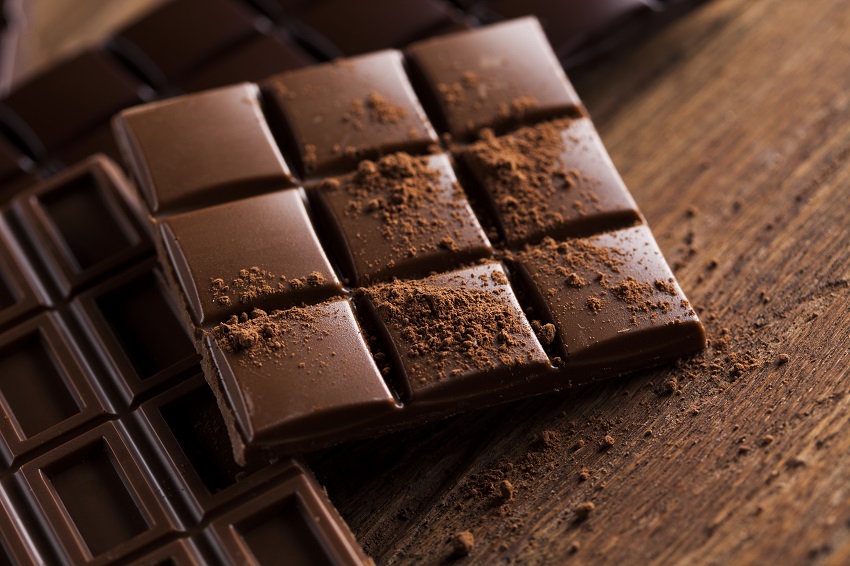 a chocolate bar on a wooden table