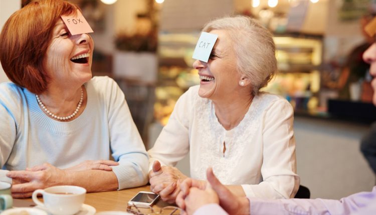 a group of older adults playing cards together