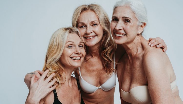 Three older adults wearing bra