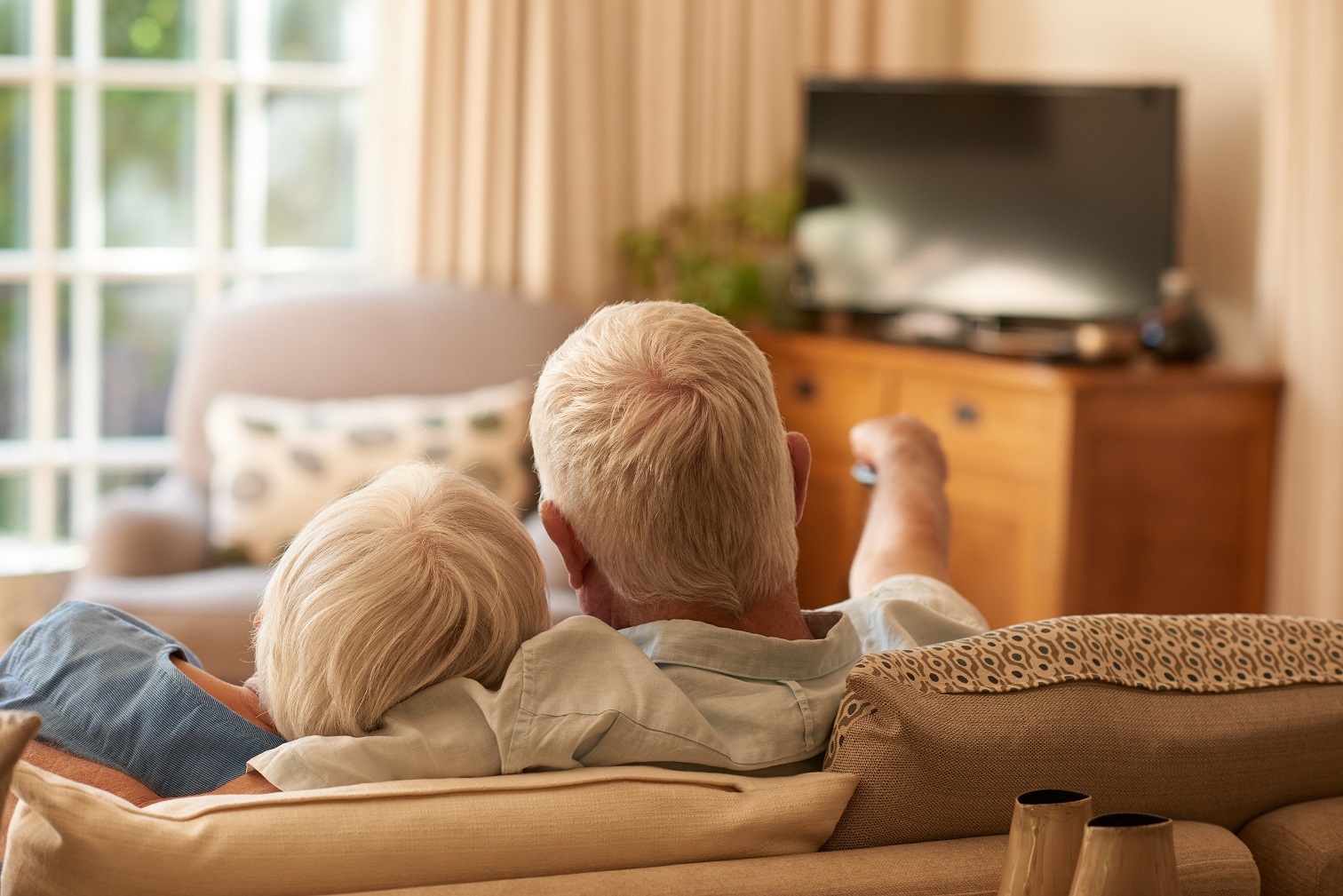 Dementia movies. Senior couple watching movies about Alzheimer's.