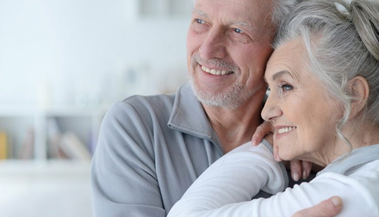 Attractive senior couple hugging one another (myths about ageing)