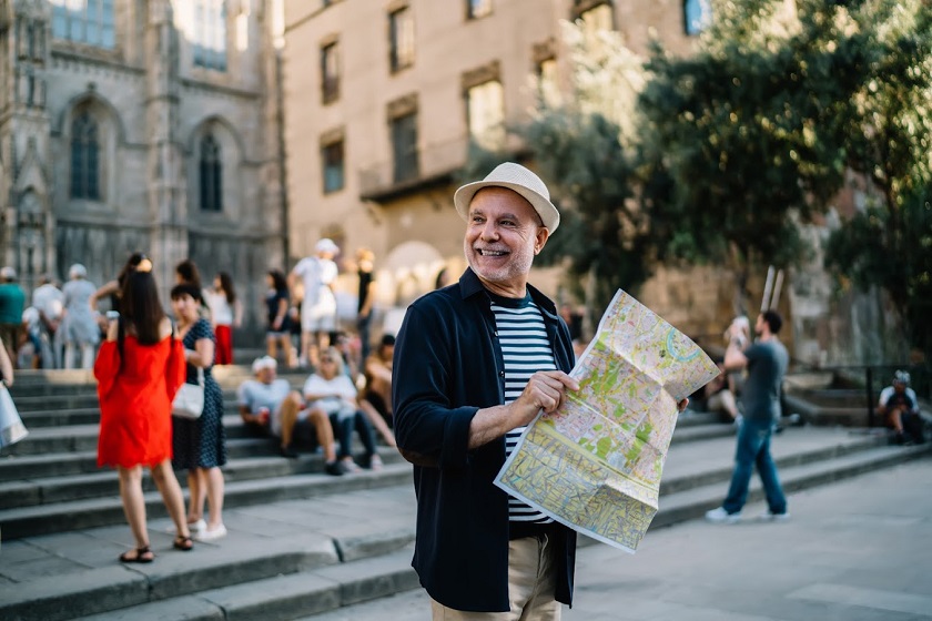 Happy Caucasian man 60s enjoying solo trip 