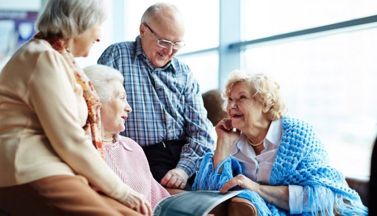 A group of seniors happily talking to each other after ageing
