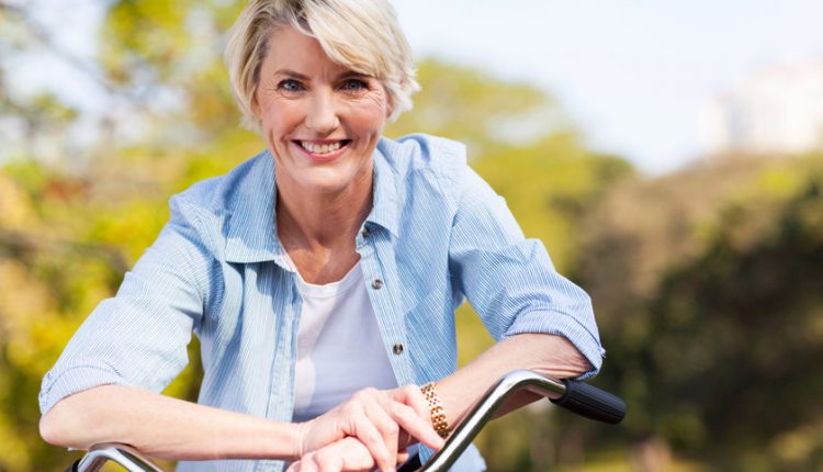 Attractive mature woman on a bike