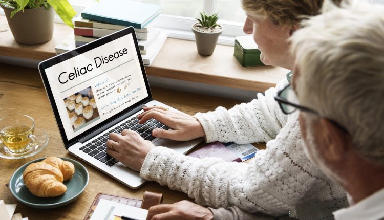 Senior couple searching about Celiac disease on their laptop