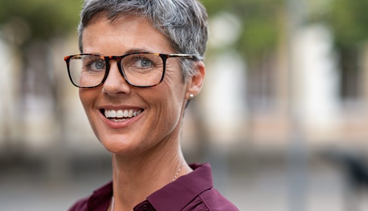 Attractive senior woman in glasses smiling