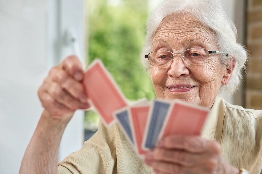 Elderly Woman in the Living Room, Playing Cards
