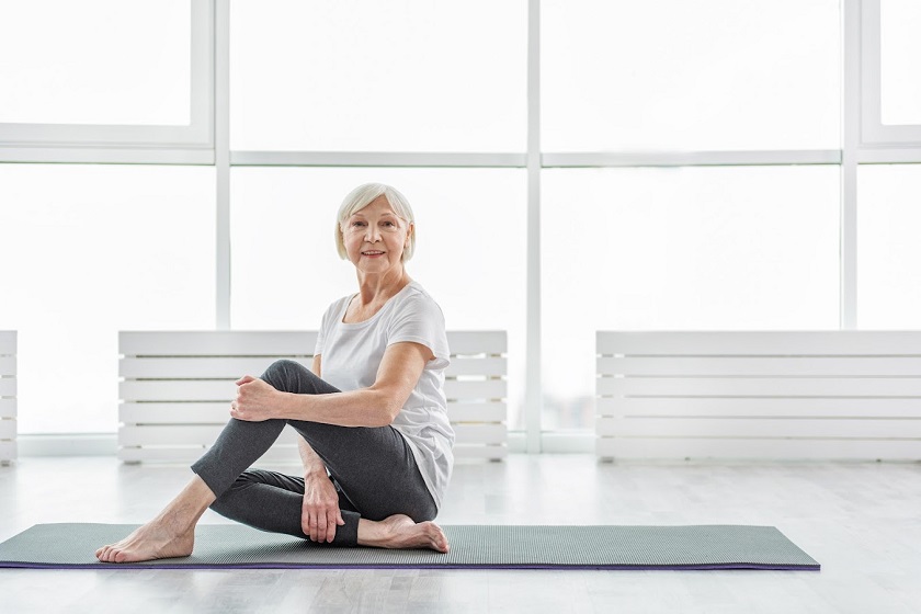 Senior lady prefers healthy lifestyle, doing yoga