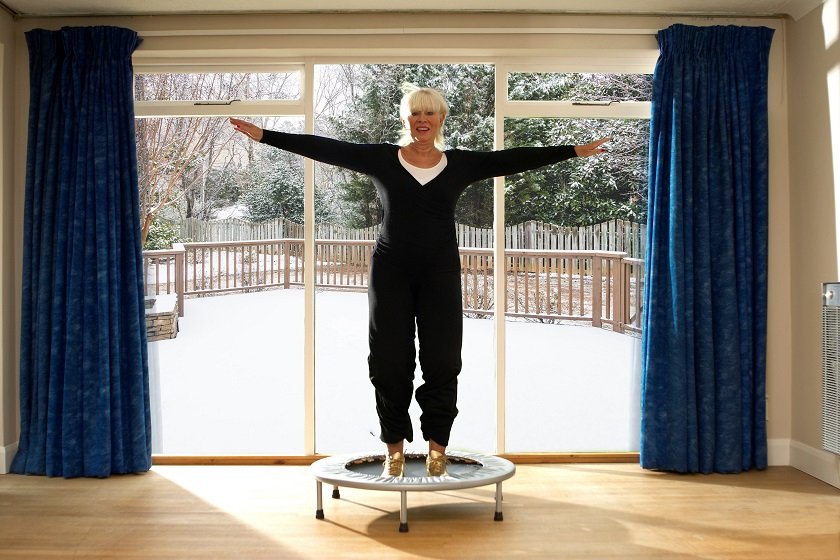 Woman jumping on exercise trampoline