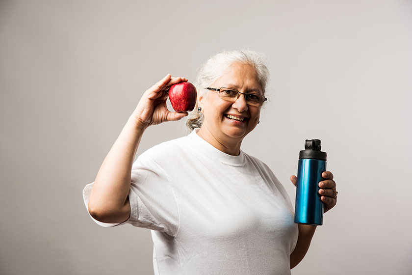 Senior lady exercising - Women Fitness and age concept