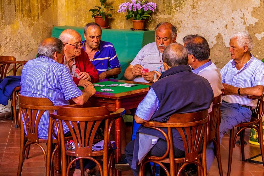 A group of senior men playing games to combat depression