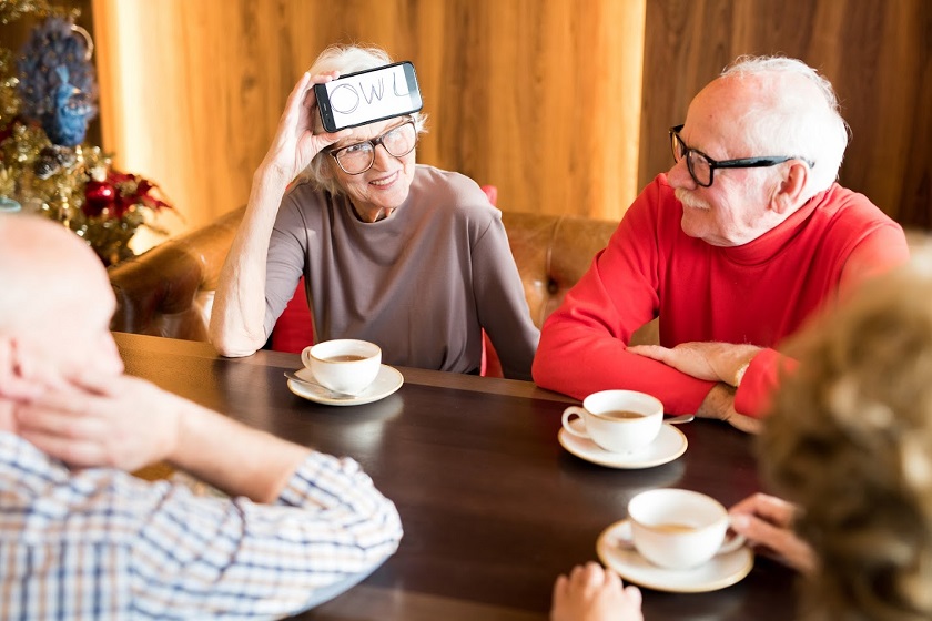 Seniors playing HeadsUp mobilegame