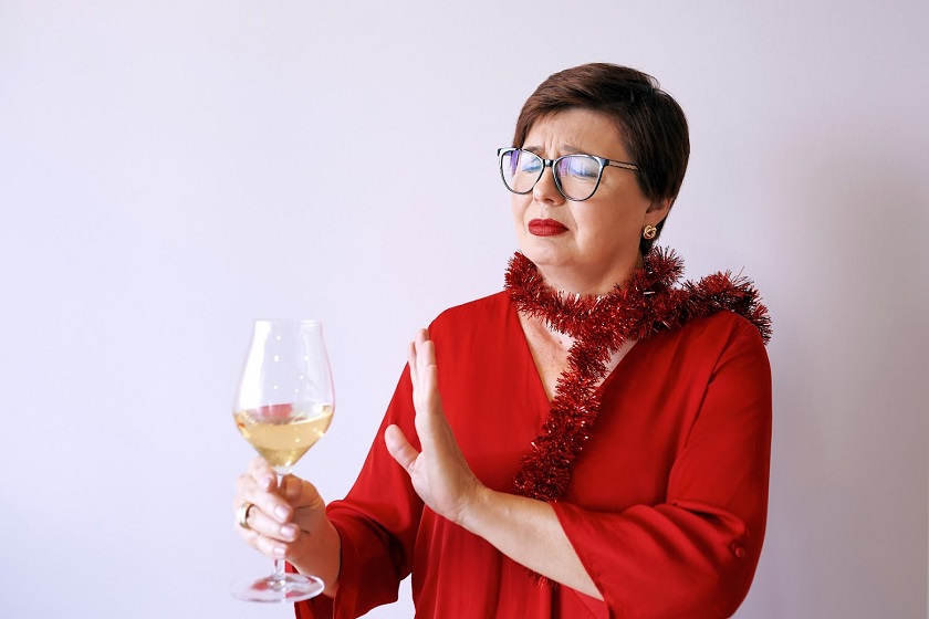 stylish senior woman refusing alcohol for better health
