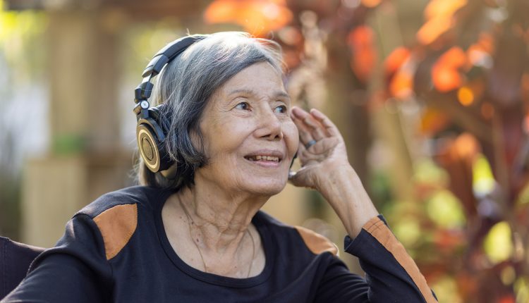 Senior woman listening to music