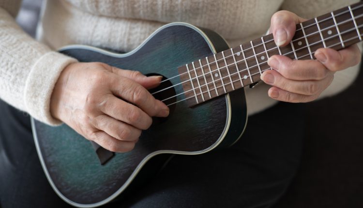 Senior woman playing instrument