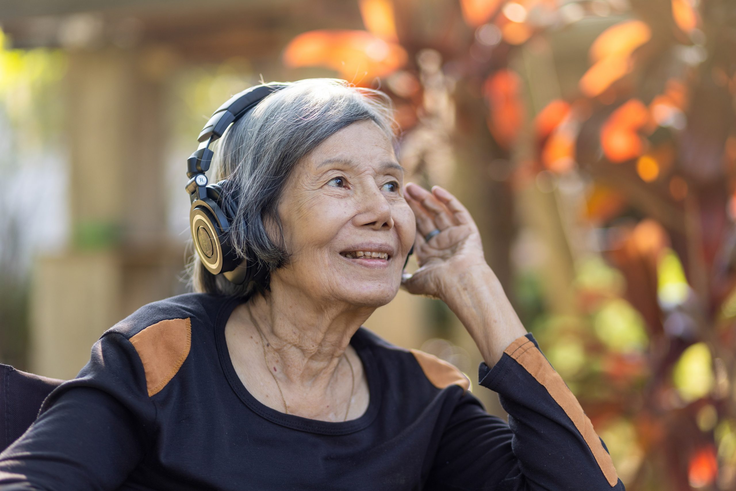 Senior woman listening to music