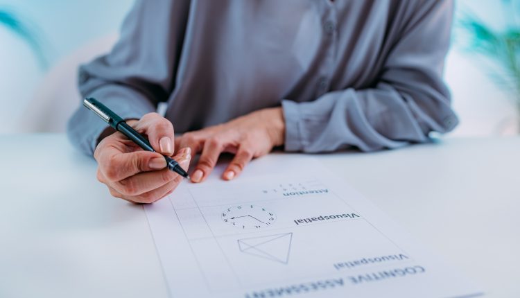 Senior woman doing cognitive Alzheimer's test