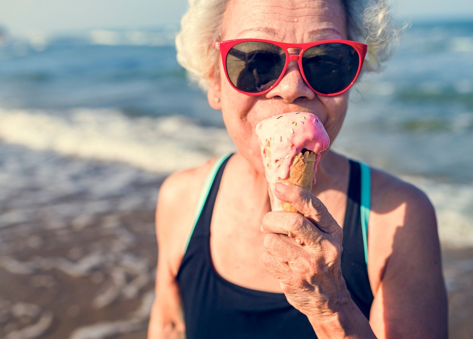 soft foods for Alzheimer's patients, Senior woman eating an ice-cream