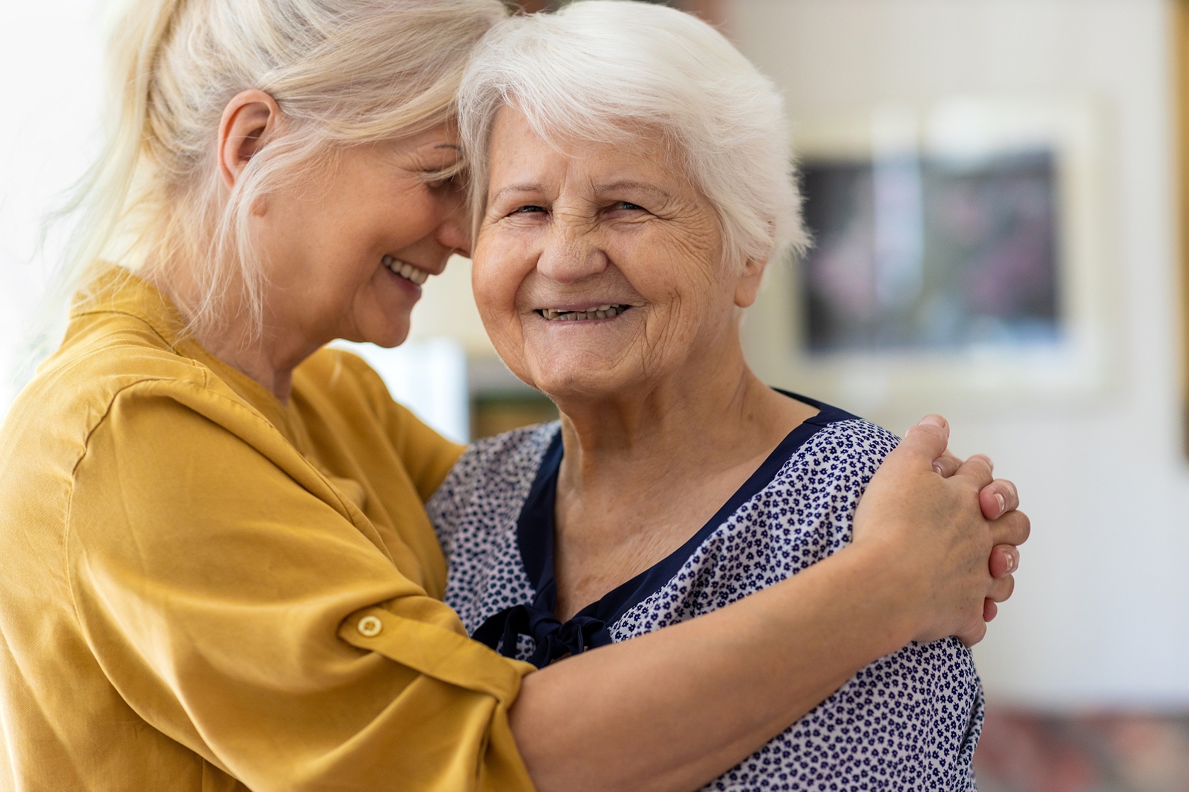 young woman and senior woman smiling 