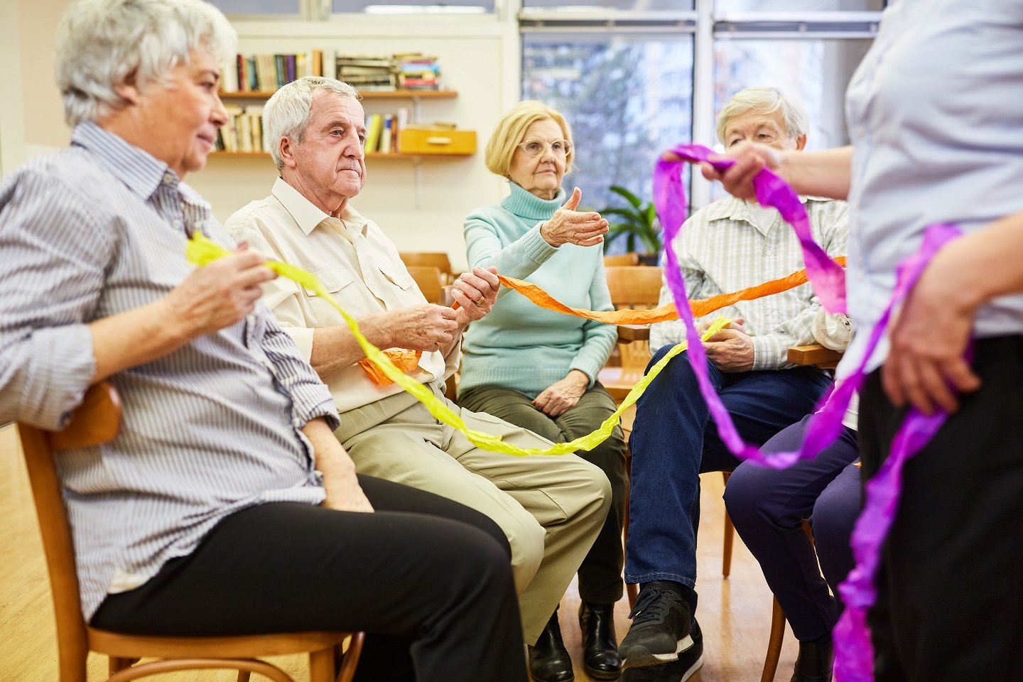 Seniors,With,Dementia,Do,An,Exercise,With,Colorful,Ribbons,For