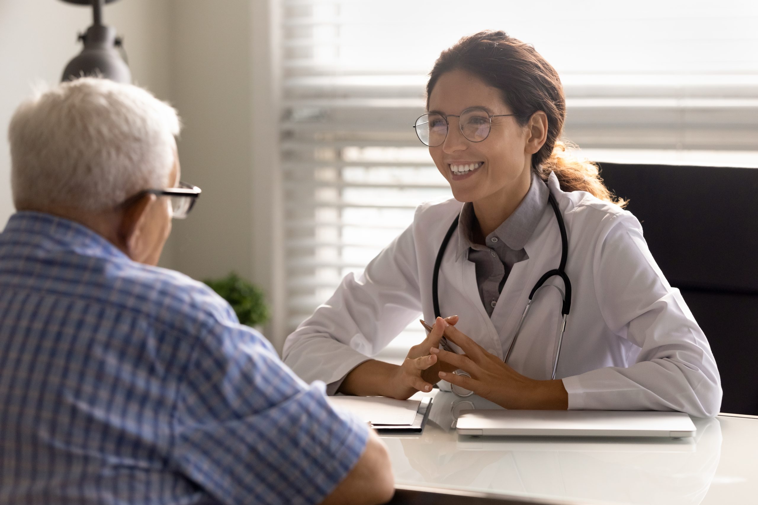 Alzheimer's test Young doctor talking to a senior patient