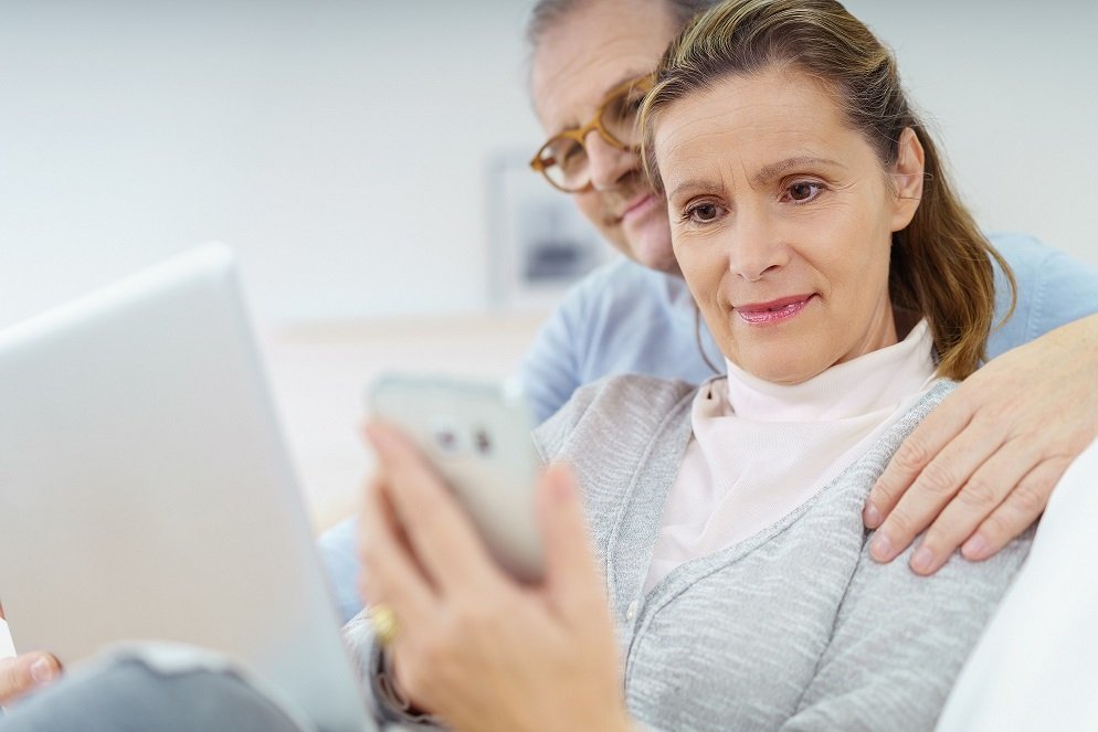 Middle-aged woman checking her mobile phone