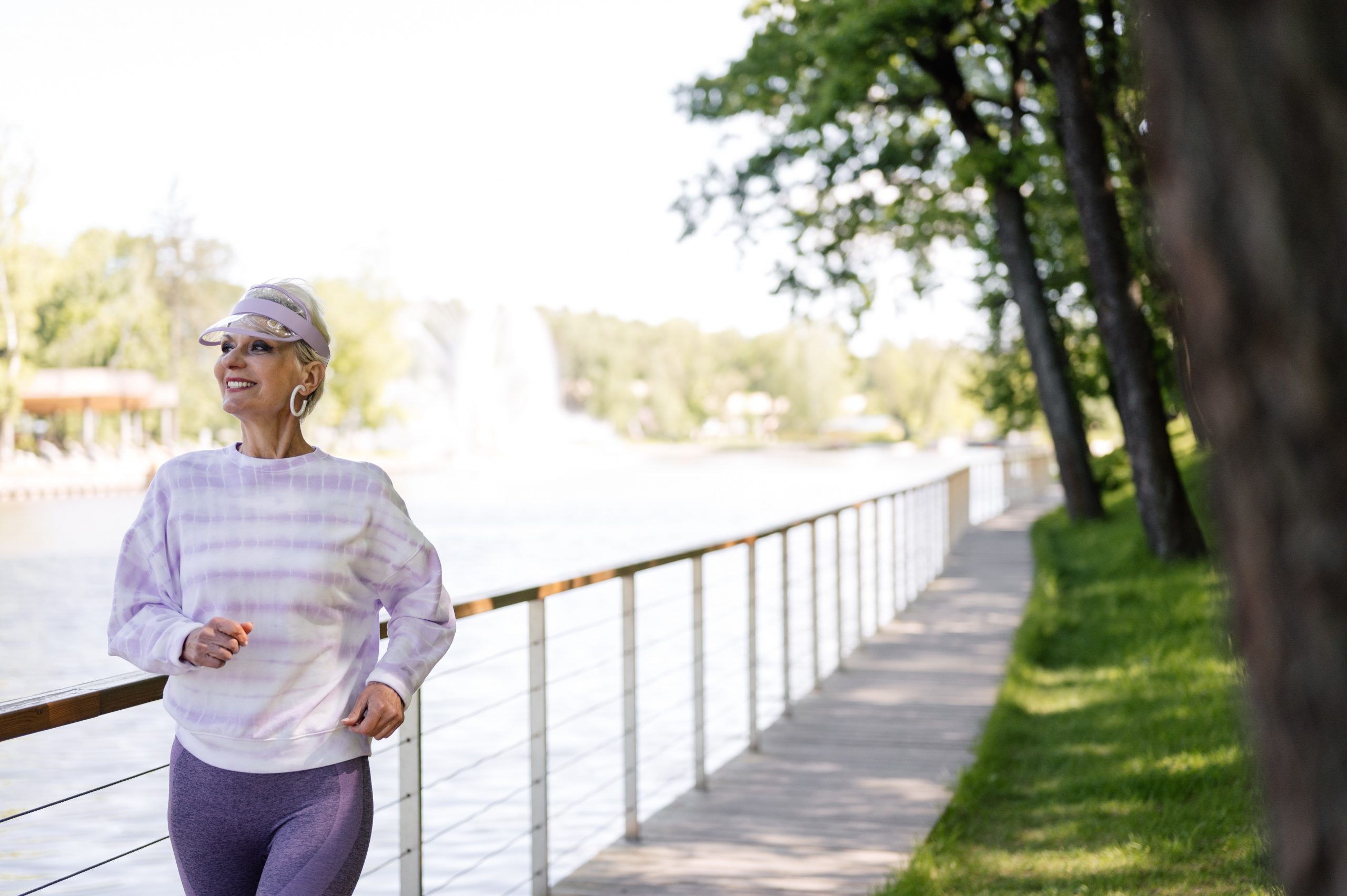 An older woman jogging.