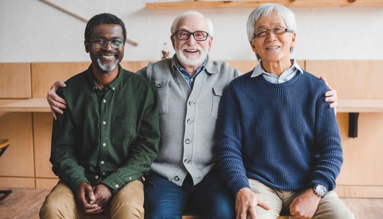 Three Senior Men Smiling to the Camera