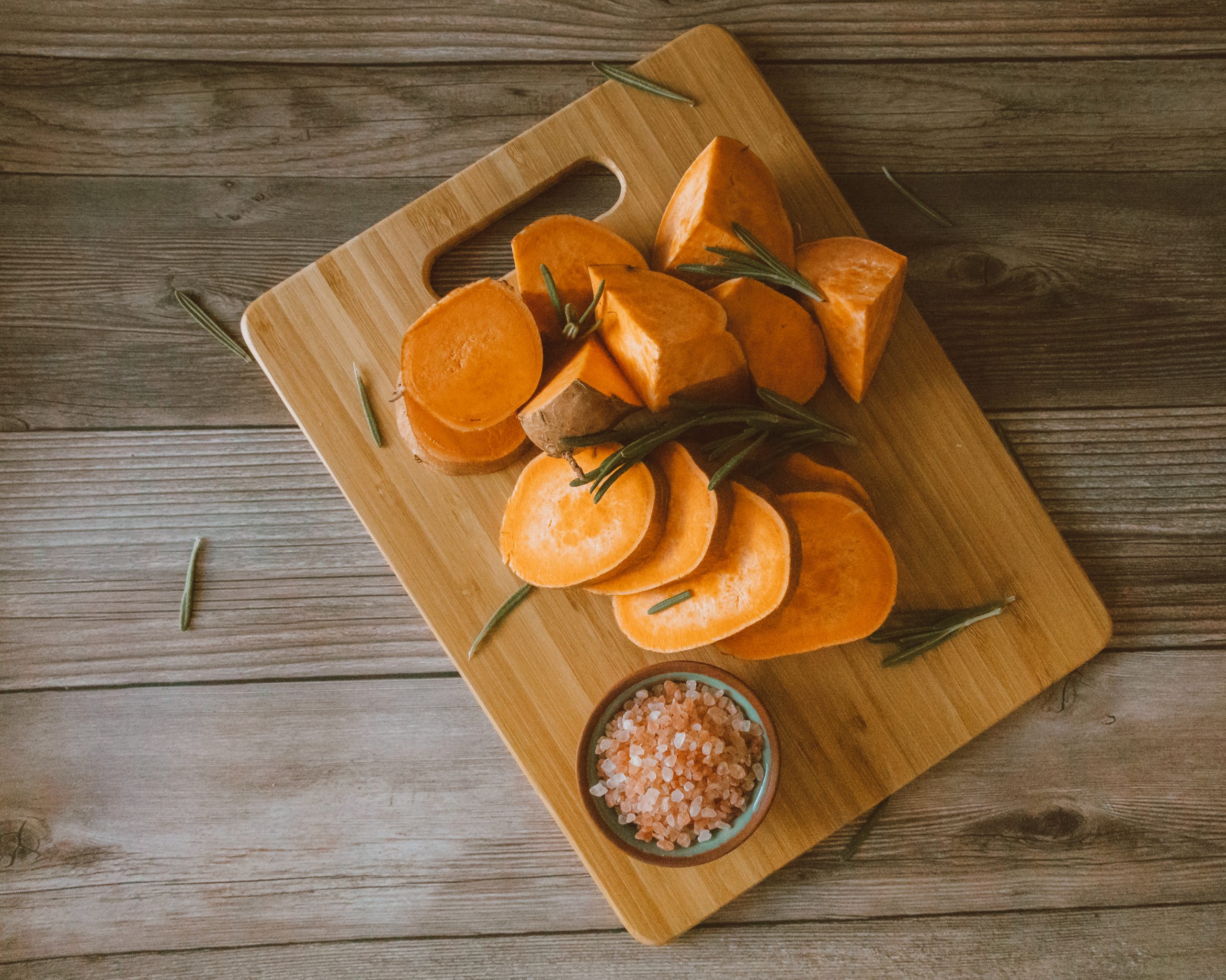 Chopped pumpkins on kitchen board