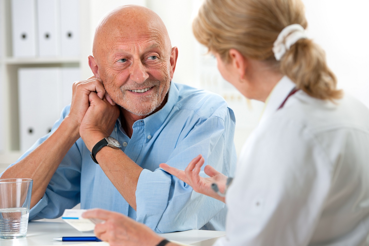 Doctor,Talking,To,Her,Male,Senior,Patient,At,Office